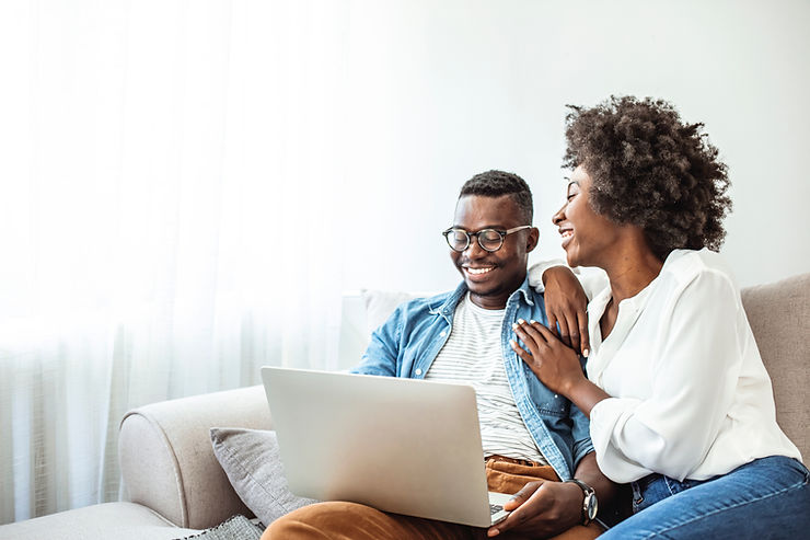 young couple looking at laptop screen for short term loan