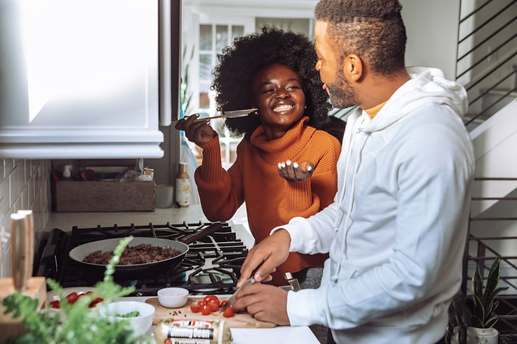 couple cooking in the kitchen together for valentine's day